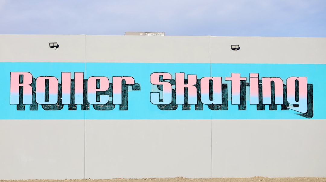 a large sign on the side of a building that says roller skating