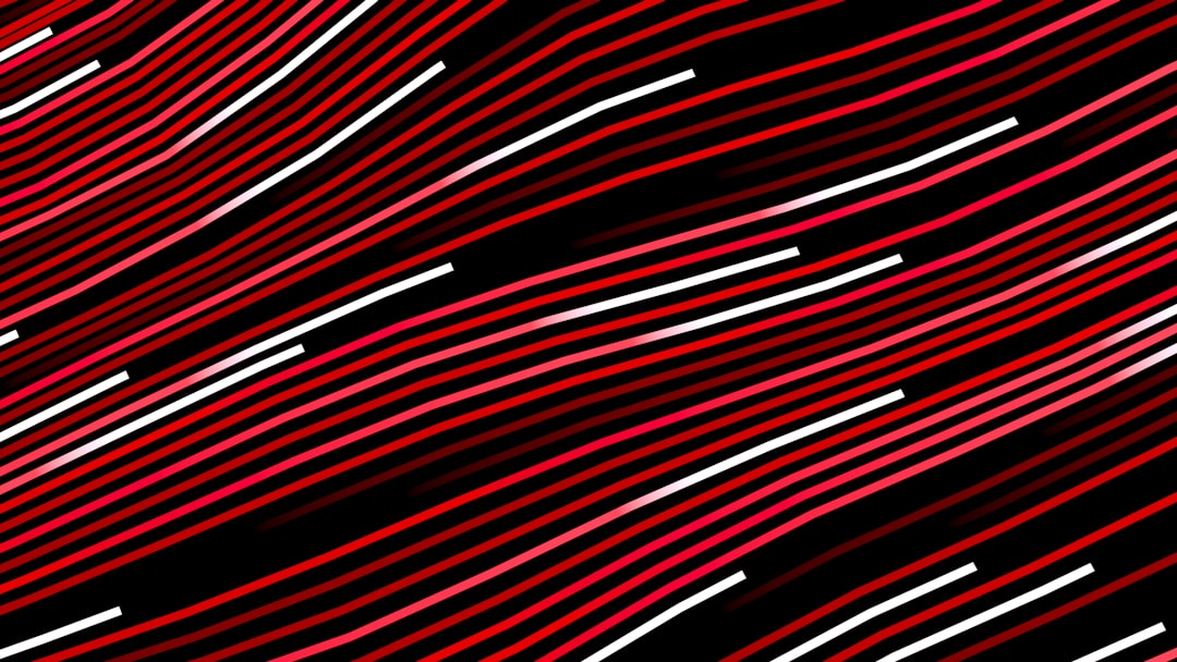 Abstract red and white wavy lines on black background